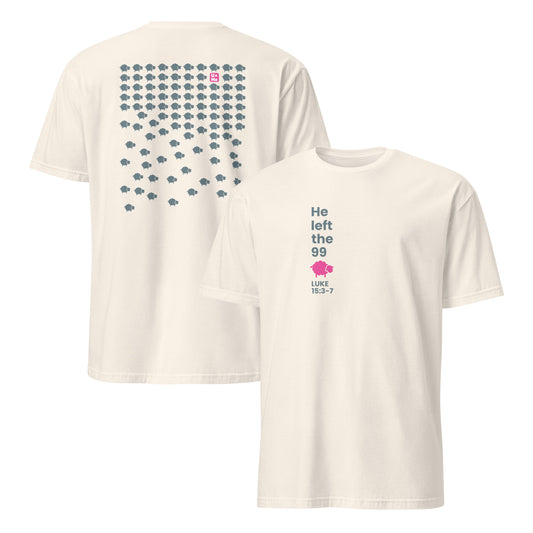 Two natural off-white short-sleeve t-shirts shown on a plain white background, with the back view on the left and the front view on the right. The front says He left the 99 with a pink sheep icon. It also says Luke 15:3-7. The back has a large grid of small grey sheep icons with one pink sheep icon near the top.