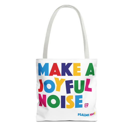 A white canvas tote bag with two shoulder straps, featuring the colourful text 'MAKE A JOYFUL NOISE' in multicoloured letters and the 'PSALMS 100:1' in the bottom right corner