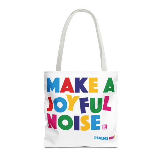 A white canvas tote bag with two shoulder straps, featuring the colourful text 'MAKE A JOYFUL NOISE' in multicoloured letters and the 'PSALMS 100:1' in the bottom right corner