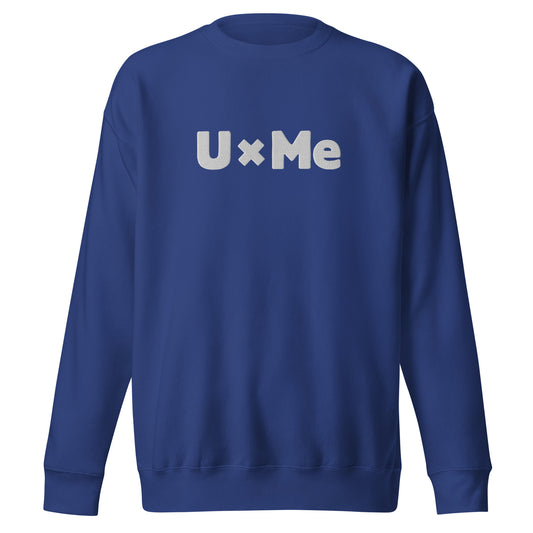 A blue crew neck sweatshirt with the text 'UxMe' embroidered in bold white letters across the chest
